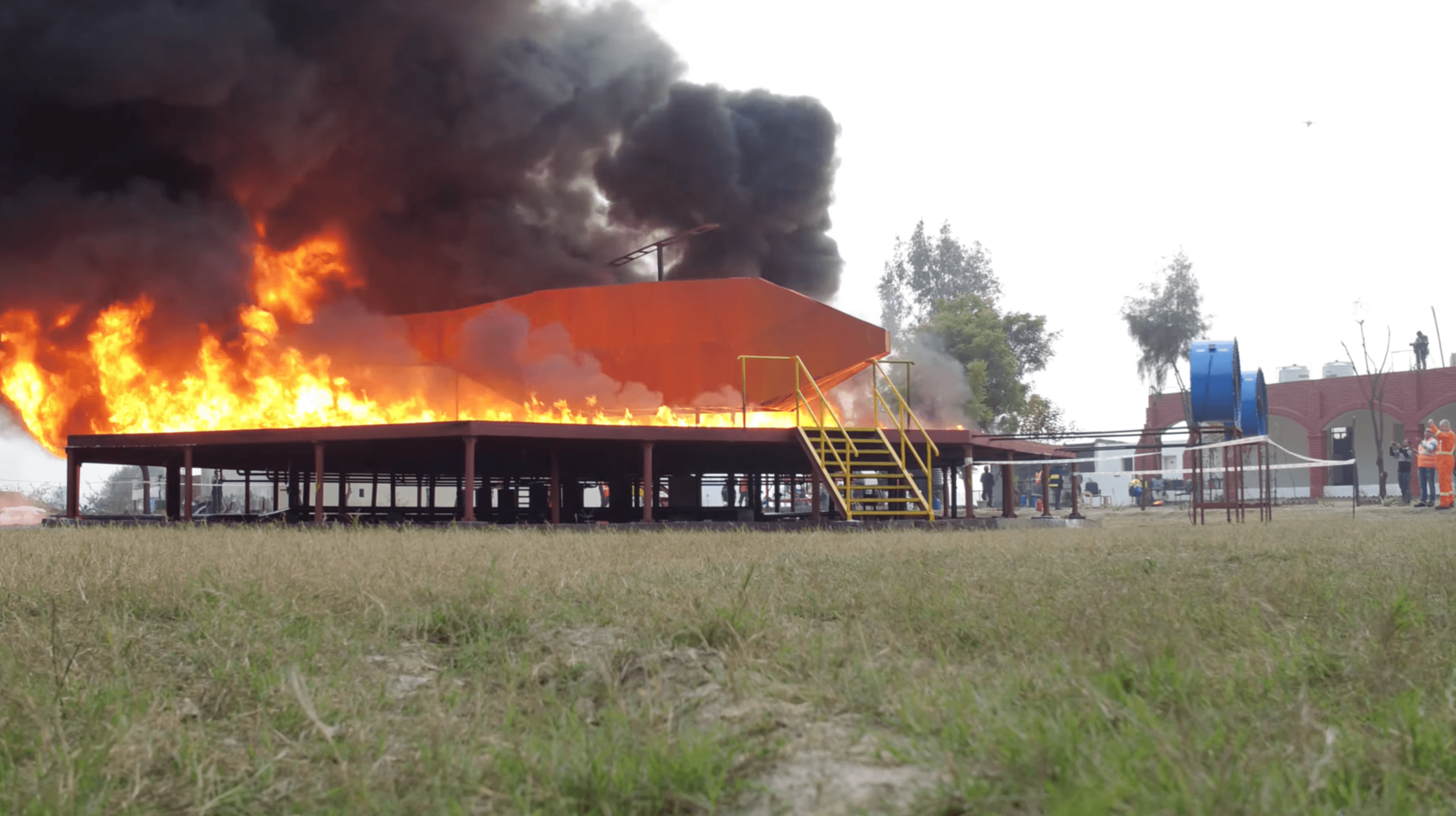 Ground-level view of fire test structure during testing